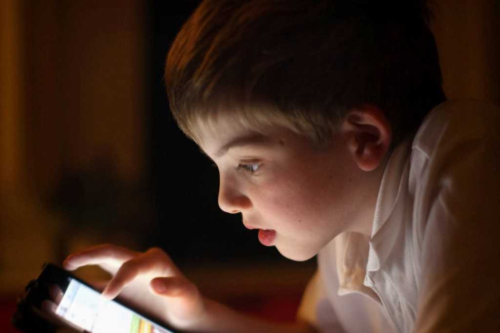 A-ten-year-old-boy-uses-an-Apple-Ipad-tablet-computer-1825487