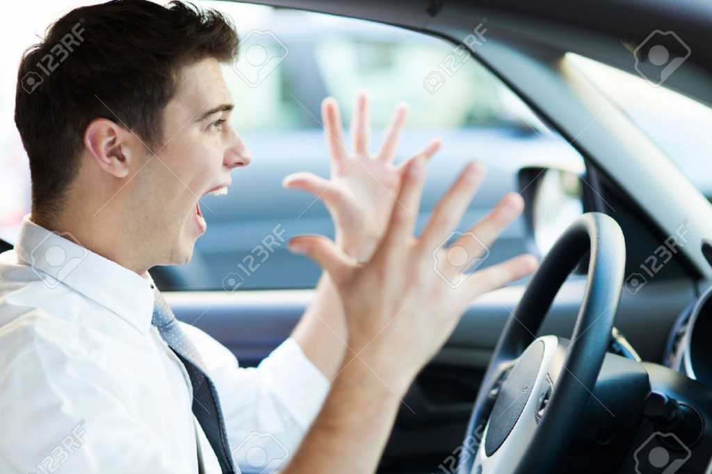 23377214-Frustrated-man-driving-car-Stock-Photo-traffic-angry-car